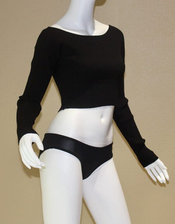 A mannequin wearing black and white underwear.