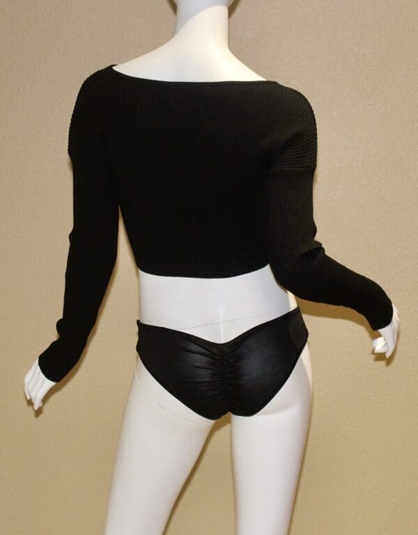 A mannequin wearing black and white underwear.