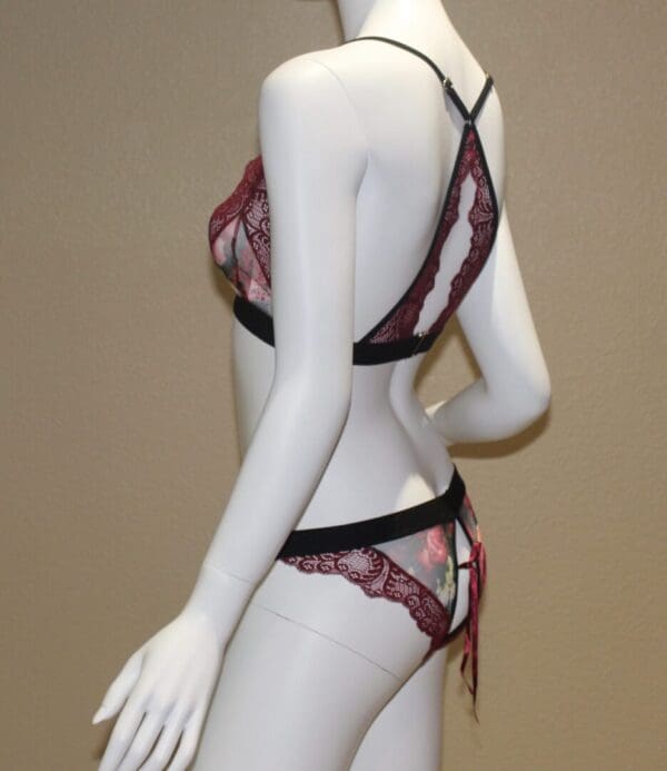 A mannequin wearing lingerie and posing for the camera.