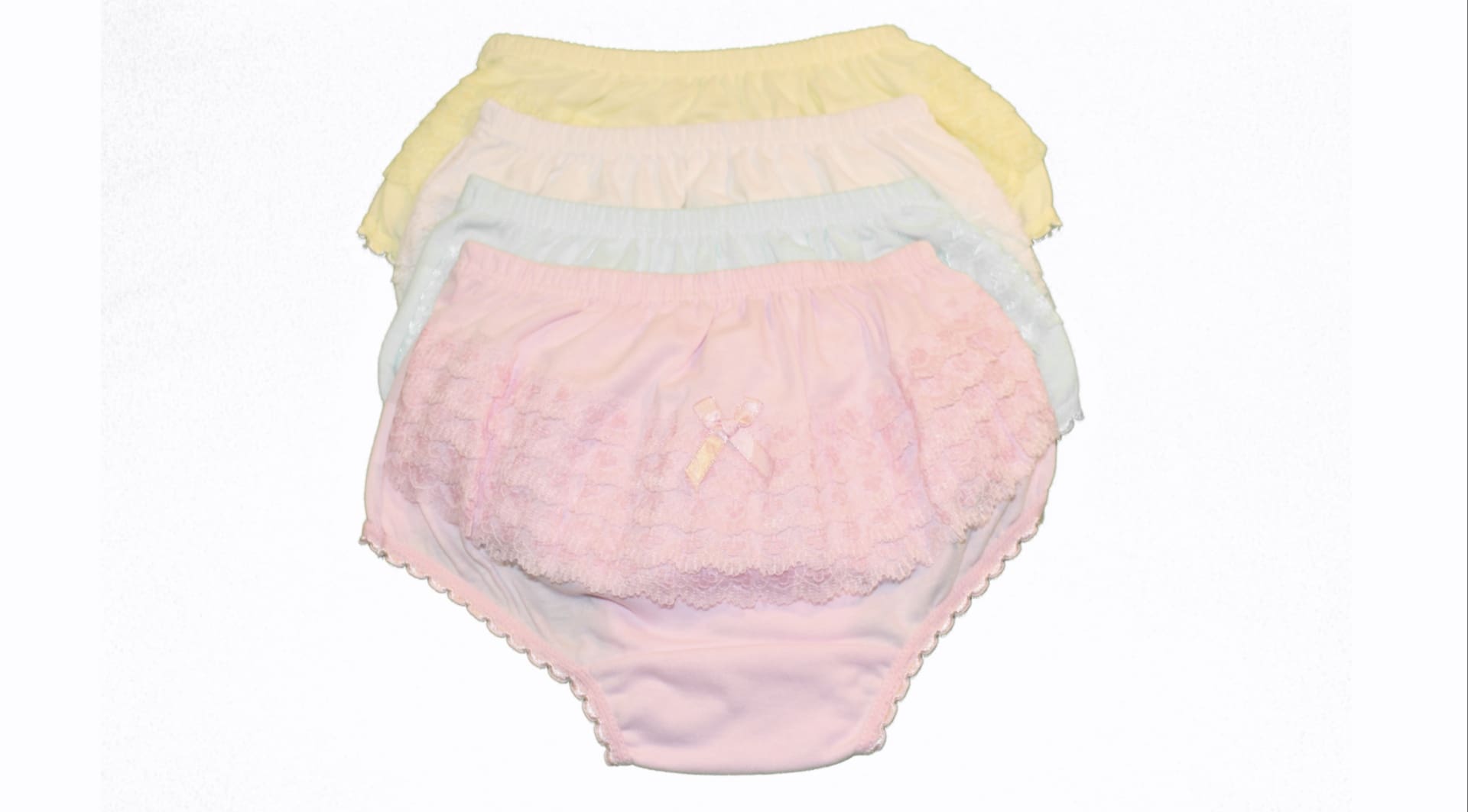 A set of four baby bloomers in pastel colors.