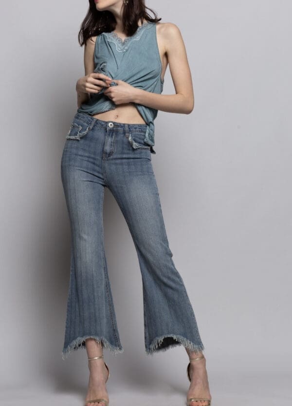 A woman in jeans and a blue top