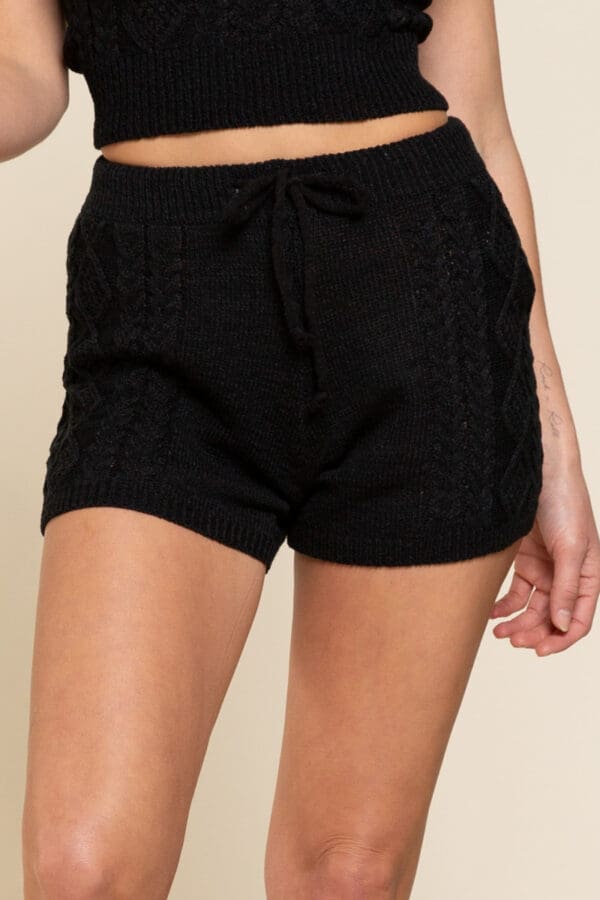 A close up of the shorts on a woman