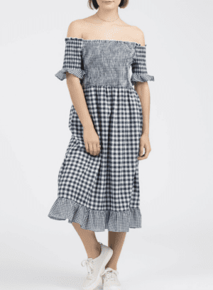 A woman in a dress standing on the ground