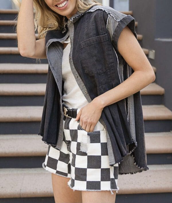 A woman in black and white checkered shorts.