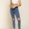 A woman in white shirt and blue jeans
