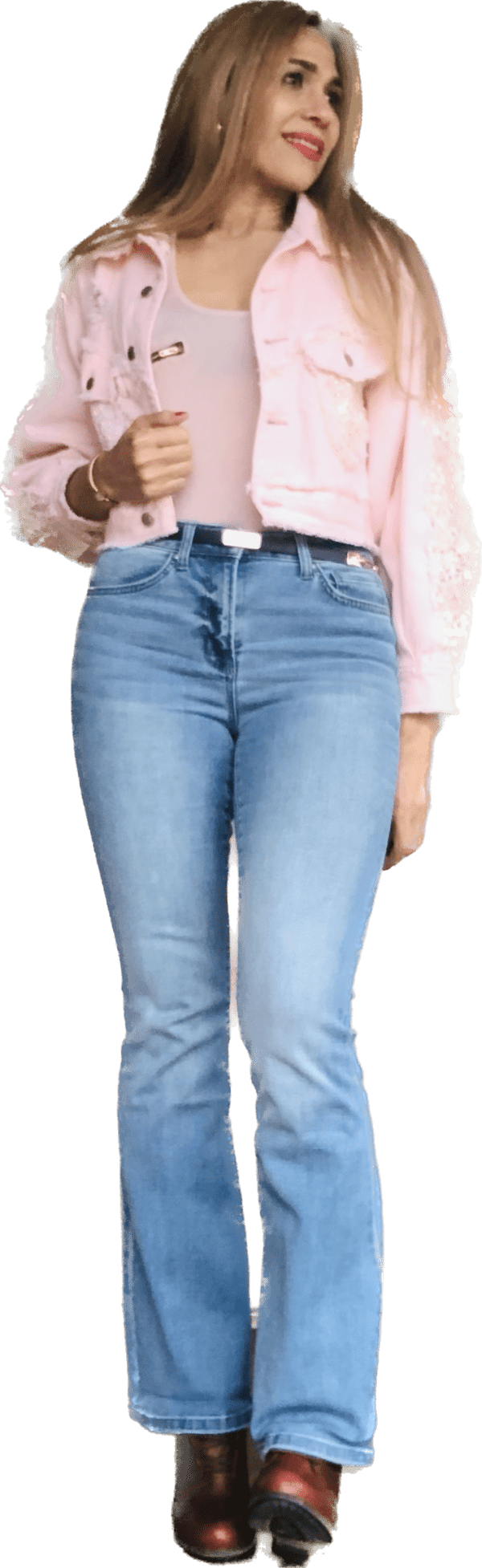 A woman wearing jeans and a pink shirt.