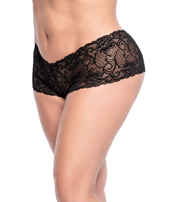 A woman in black lace panties standing up.