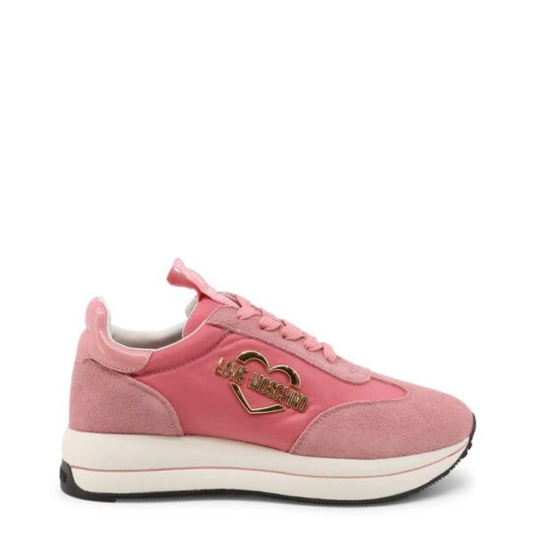 A pink sneaker with a heart on the side of it.