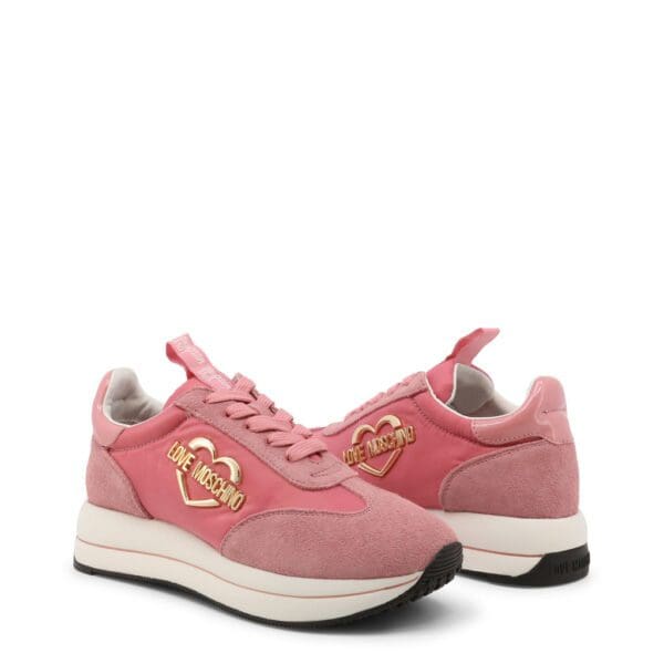 A pair of pink sneakers with gold accents.