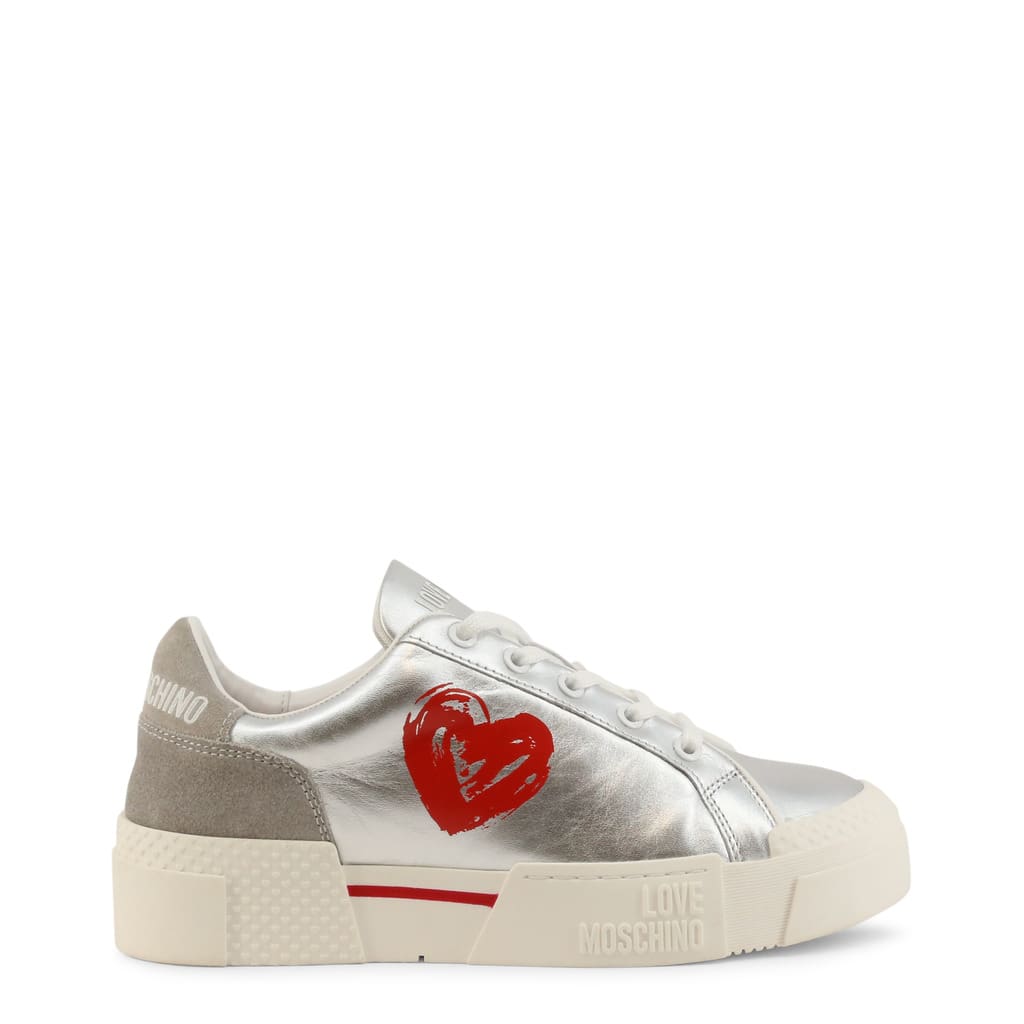 A pair of silver sneakers with red heart on the side.