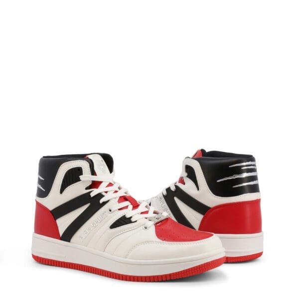 A pair of red and white sneakers on top of a white background.