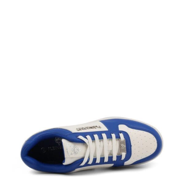 A pair of blue and white sneakers on top of a white surface.