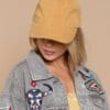 A woman wearing a yellow hat and jacket.