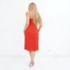 A woman in red dress standing on white background.