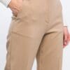 Beige women's pants, close-up view.