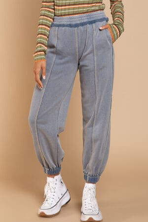 Light blue cuffed sweatpants with stitching.