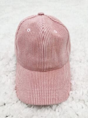 Pink corduroy baseball cap.